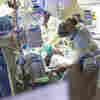 A COVID Surge Is Overwhelming U.S. Hospitals, Raising Fears Of Rationed Care