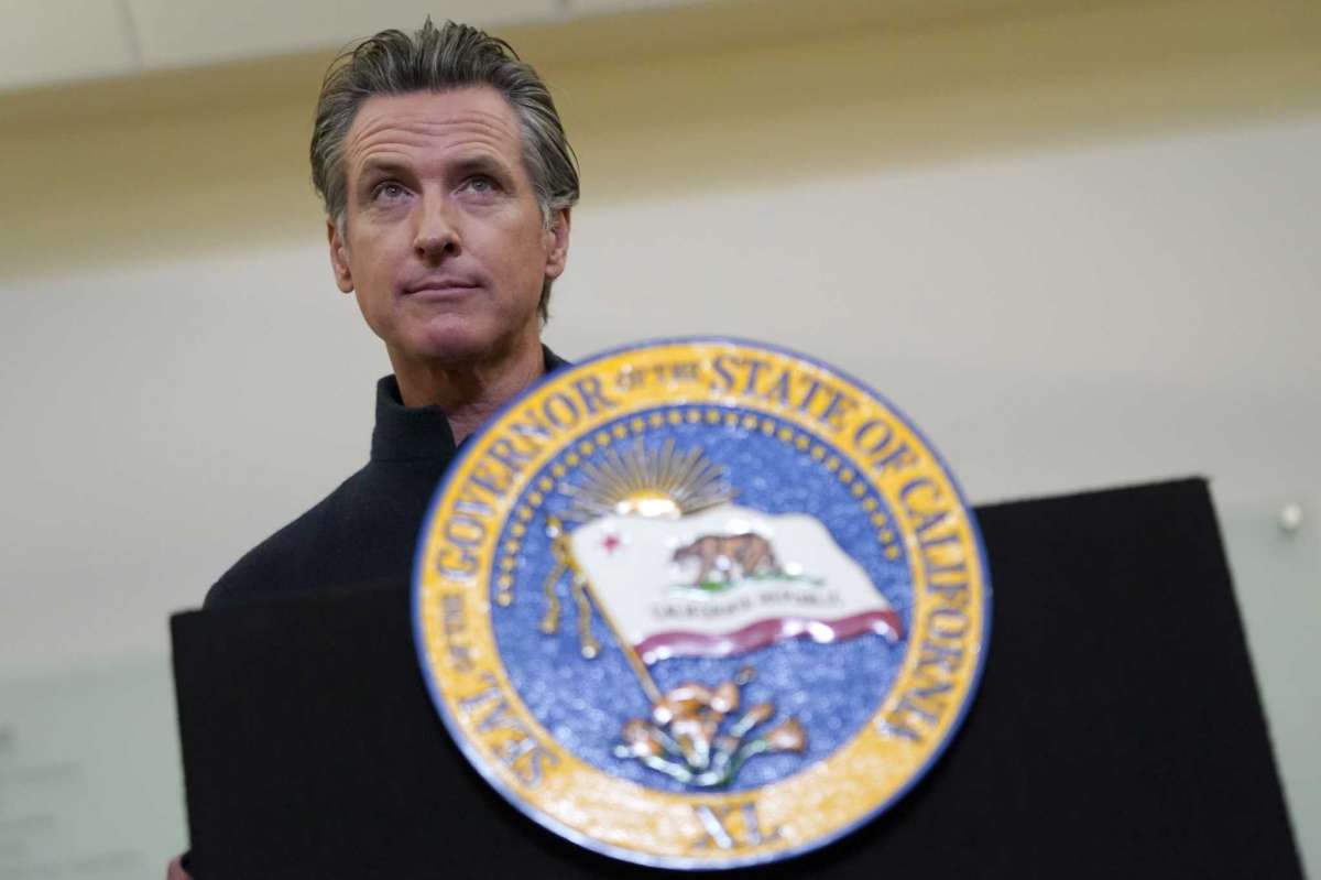 Gov. Gavin Newsom speaks at Asian Health Services in Oakland, Calif., Wednesday, Oct. 27, 2021. Newsom, who had been absent from public life for nearly two weeks after canceling his planned trip to Scotland for the United Nations climate conference.